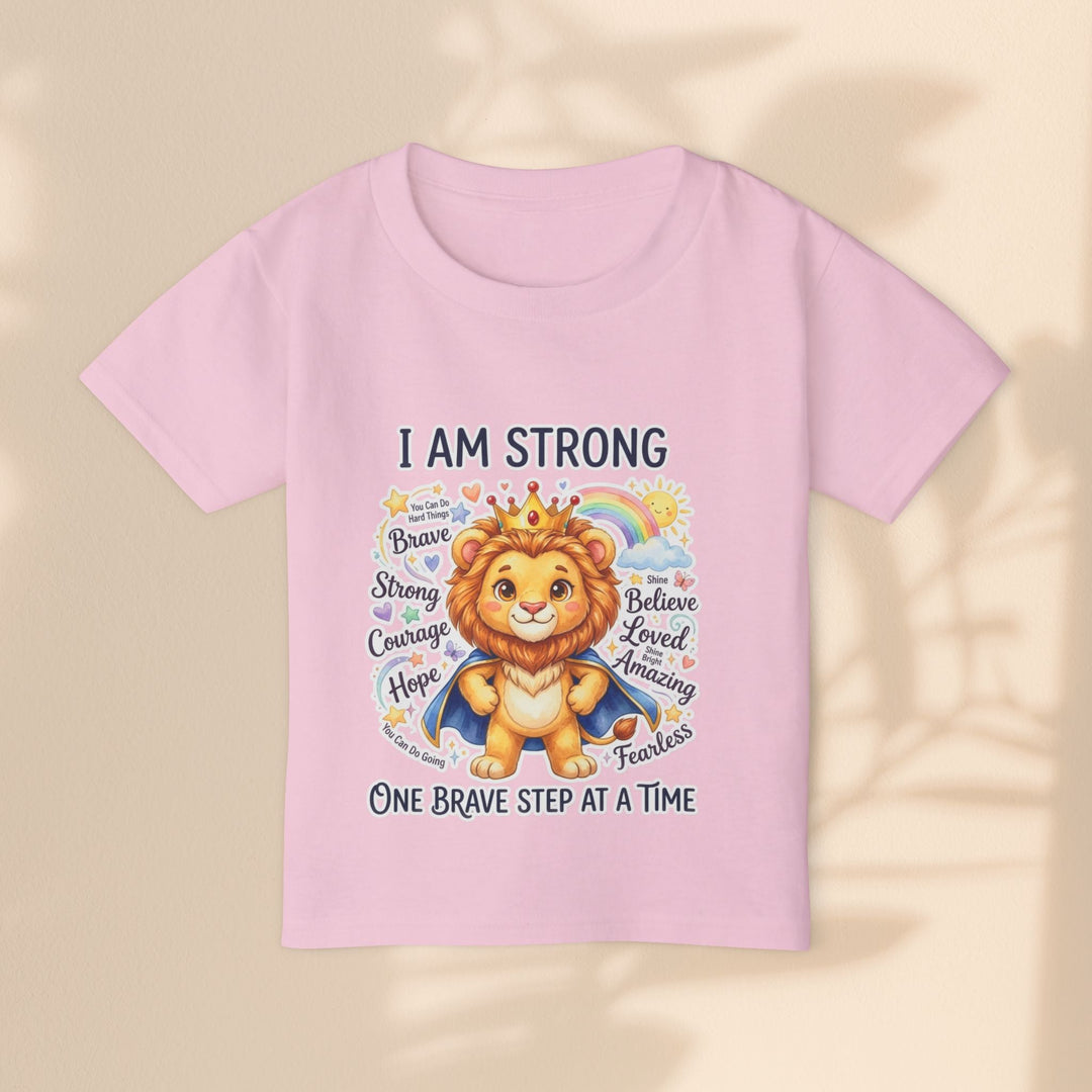 Sea Dragon Dreams toddler t-shirt in light pink cotton featuring a cute lion wearing a crown and cape with text.