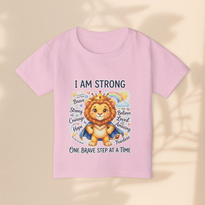 Sea Dragon Dreams toddler t-shirt in light pink cotton featuring a cute lion wearing a crown and cape with text.