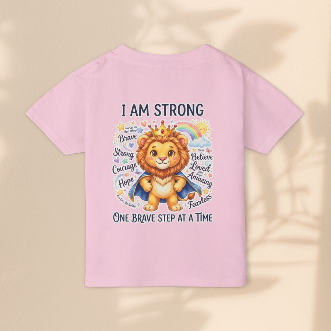 Sea Dragon Dreams toddler t-shirt in light pink featuring a courageous lion graphic with the affirmation I Am Strong.