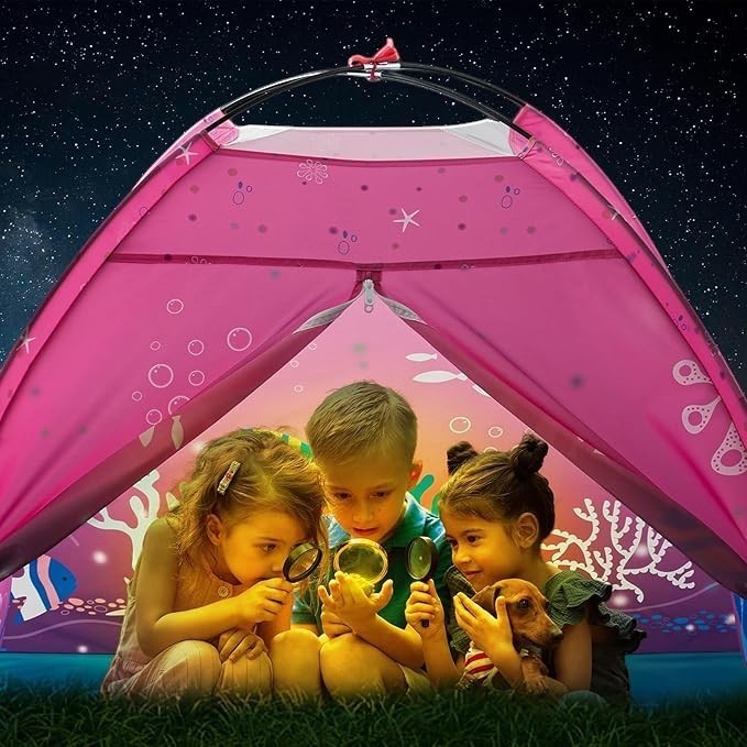 Sea Dragon Dreams pink mermaid pop-up play tent with three children exploring with magnifying glasses inside.