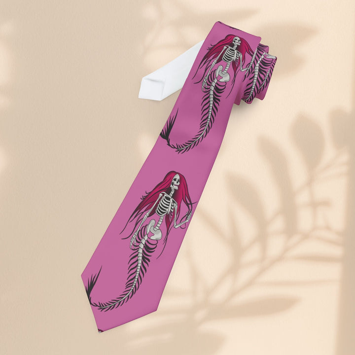 Sea Dragon Dreams pink polyester necktie featuring a repeating gothic mermaid skeleton print with long red hair.