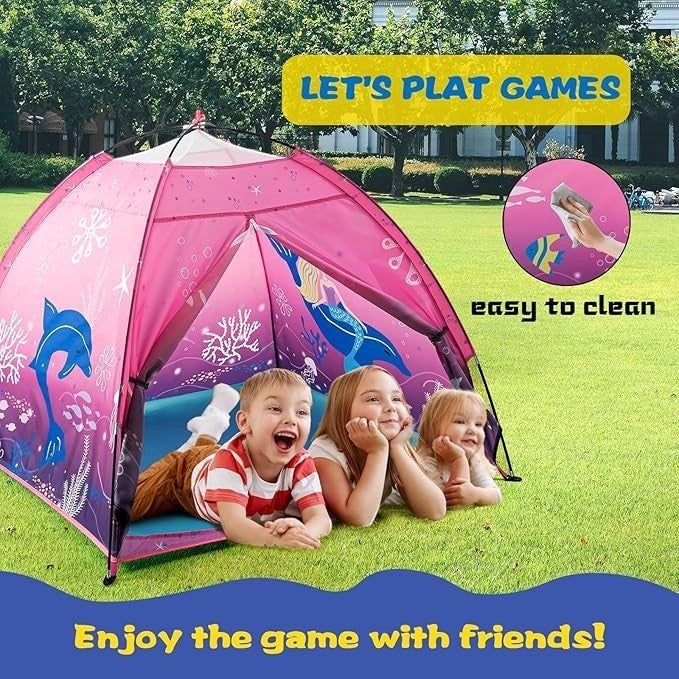 Sea Dragon Dreams pink mermaid play tent set up on a lawn with three happy children playing inside.