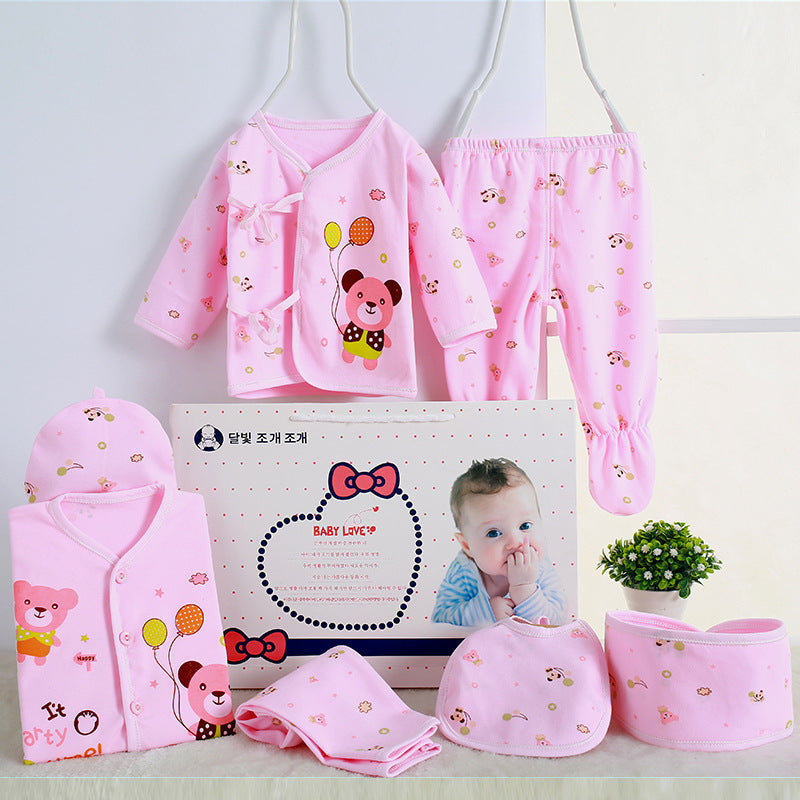 Sea Dragon Dreams newborn baby gift set in pink cotton with cute bear prints, including clothing, bib, and hat.