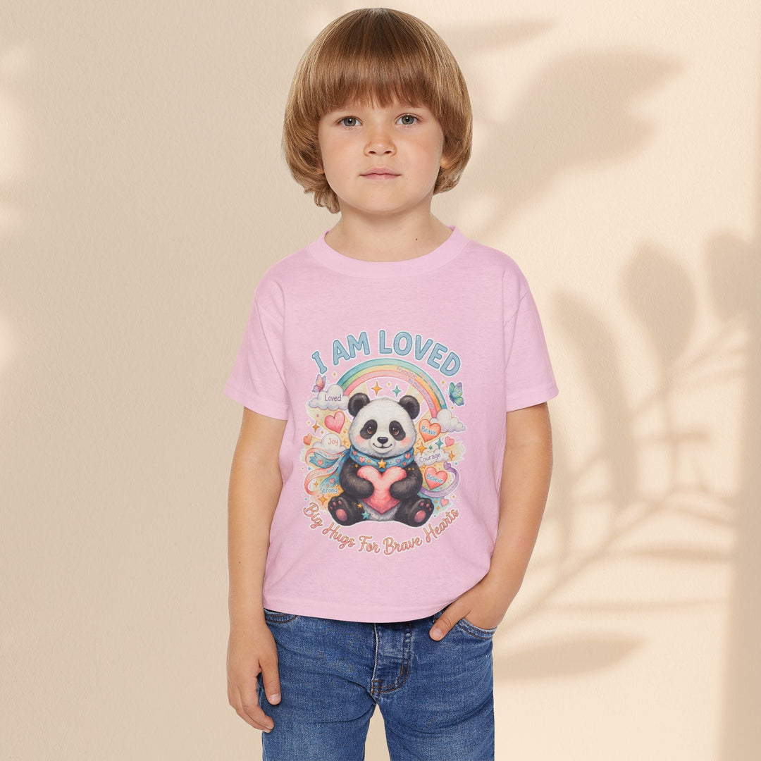 Sea Dragon Dreams toddler t-shirt in light pink cotton featuring a Huggie Panda graphic with a rainbow and heart.
