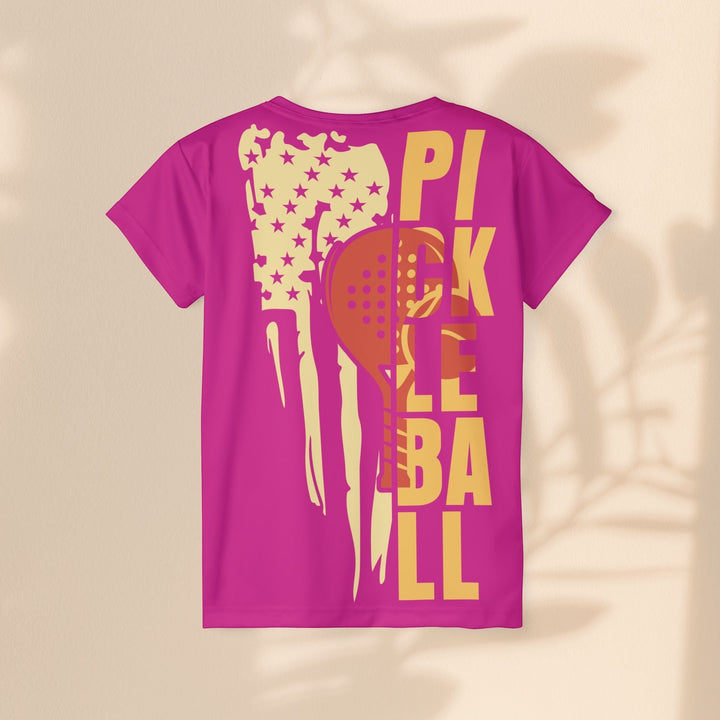 Sea Dragon Dreams women's pink moisture-wicking pickleball sports jersey with a flag and paddle graphic on the back.