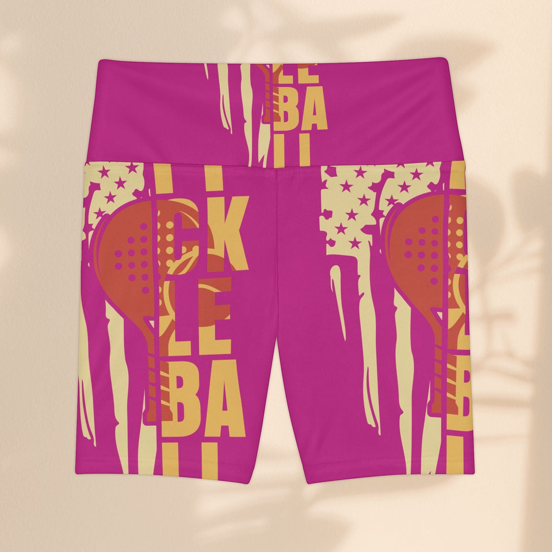 Sea Dragon Dreams pink workout shorts with a yellow pickleball paddle graphic and stars, made of polyester.
