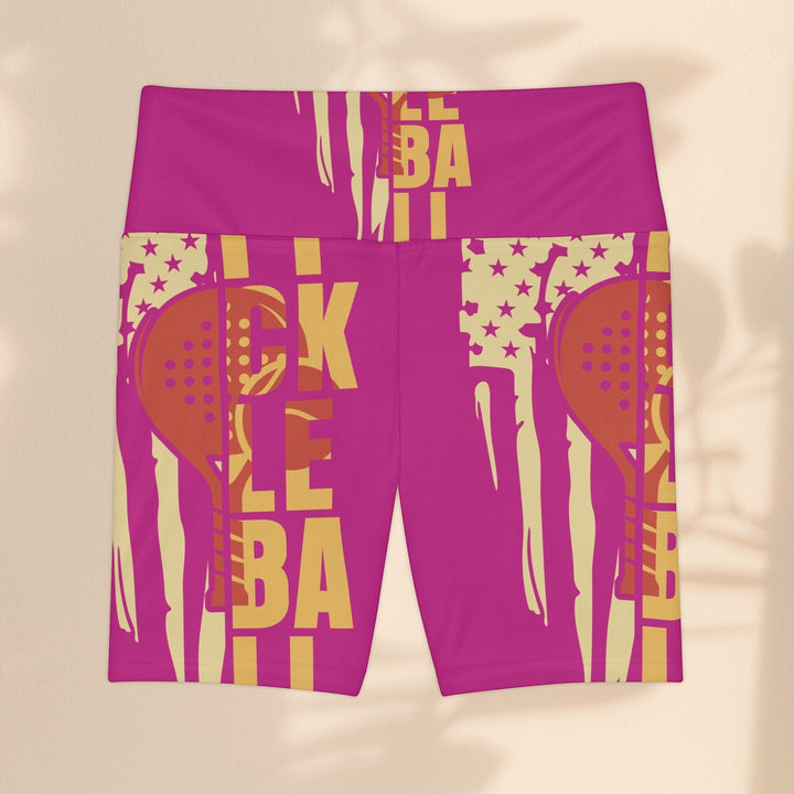 Sea Dragon Dreams pink workout shorts with a yellow pickleball paddle graphic and stars, made of polyester.