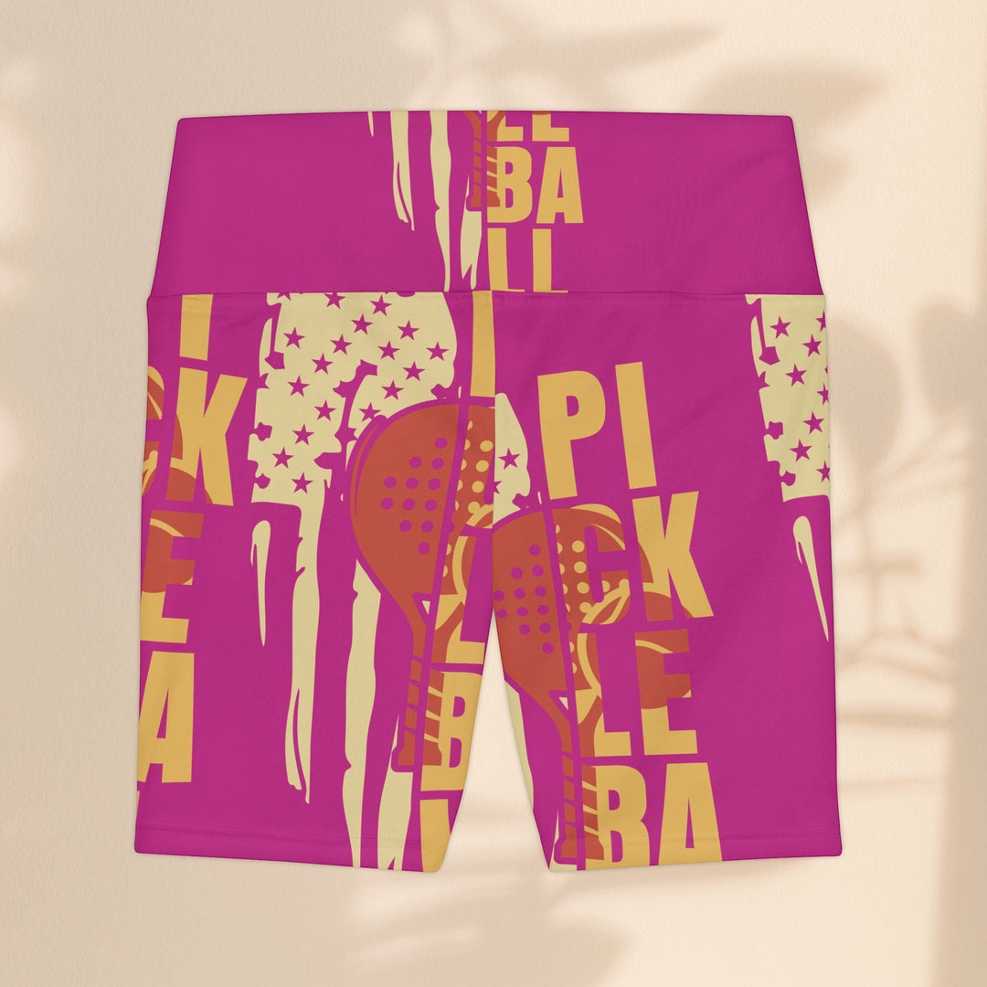 Sea Dragon Dreams pink workout shorts with yellow pickleball paddle and star graphic print for activewear.