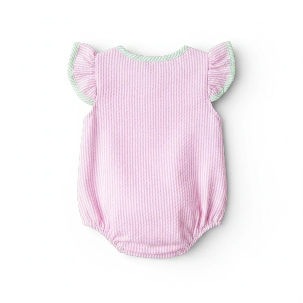 Sea Dragon Dreams pink seersucker baby girl bubble romper with flutter sleeves and green trim on a white background