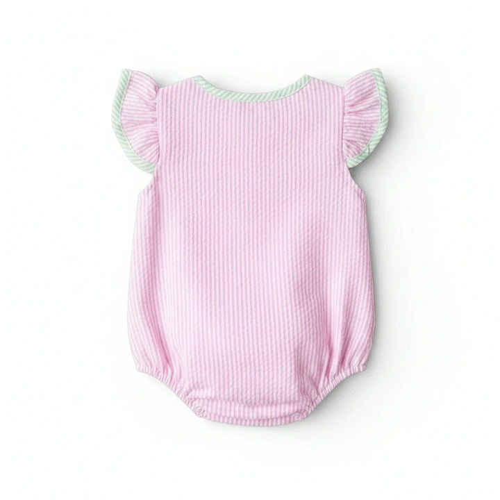 Sea Dragon Dreams pink seersucker baby girl bubble romper with flutter sleeves and green trim on a white background