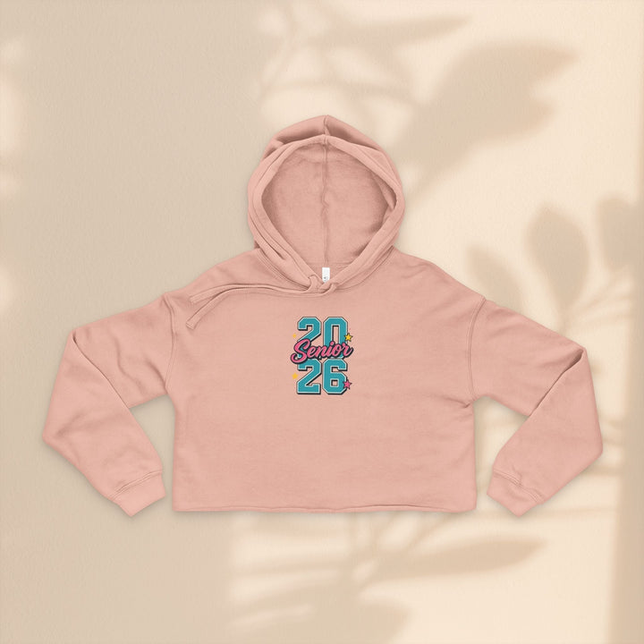 Sea Dragon Dreams pink cropped hoodie with Class of 2026 graphic, featuring dropped shoulders and raw hem.