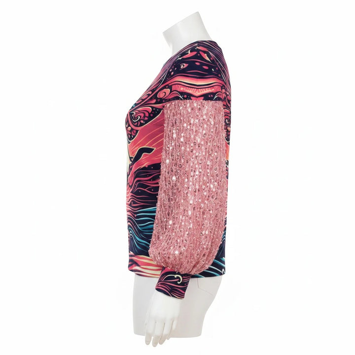 Sea Dragon Dreams women's sweatshirt with pink sequin sleeves and a vibrant heart graphic print, side view.