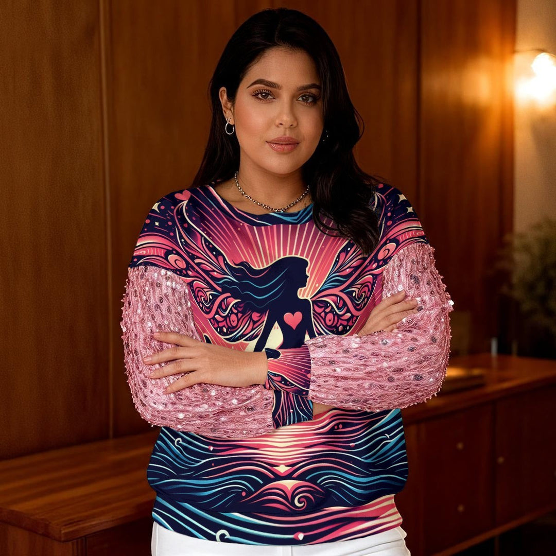 Sea Dragon Dreams sweatshirt with pink sequin sleeves and a vibrant heart-themed graphic print on a woman.