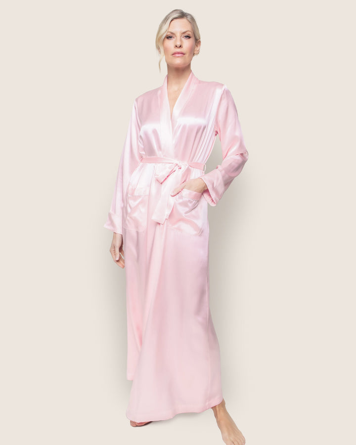 Model wearing a Sea Dragon Dreams long pink silk robe with long sleeves and an adjustable waist tie.