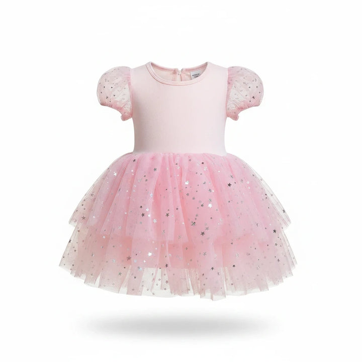 Sea Dragon Dreams girls' pink Good Witch dress with puff sleeves and a layered tulle skirt featuring silver stars.