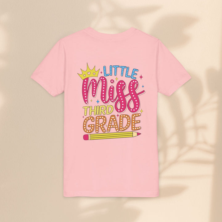 Sea Dragon Dreams light pink youth t-shirt with Little Miss Third Grade graphic featuring a crown and pencil