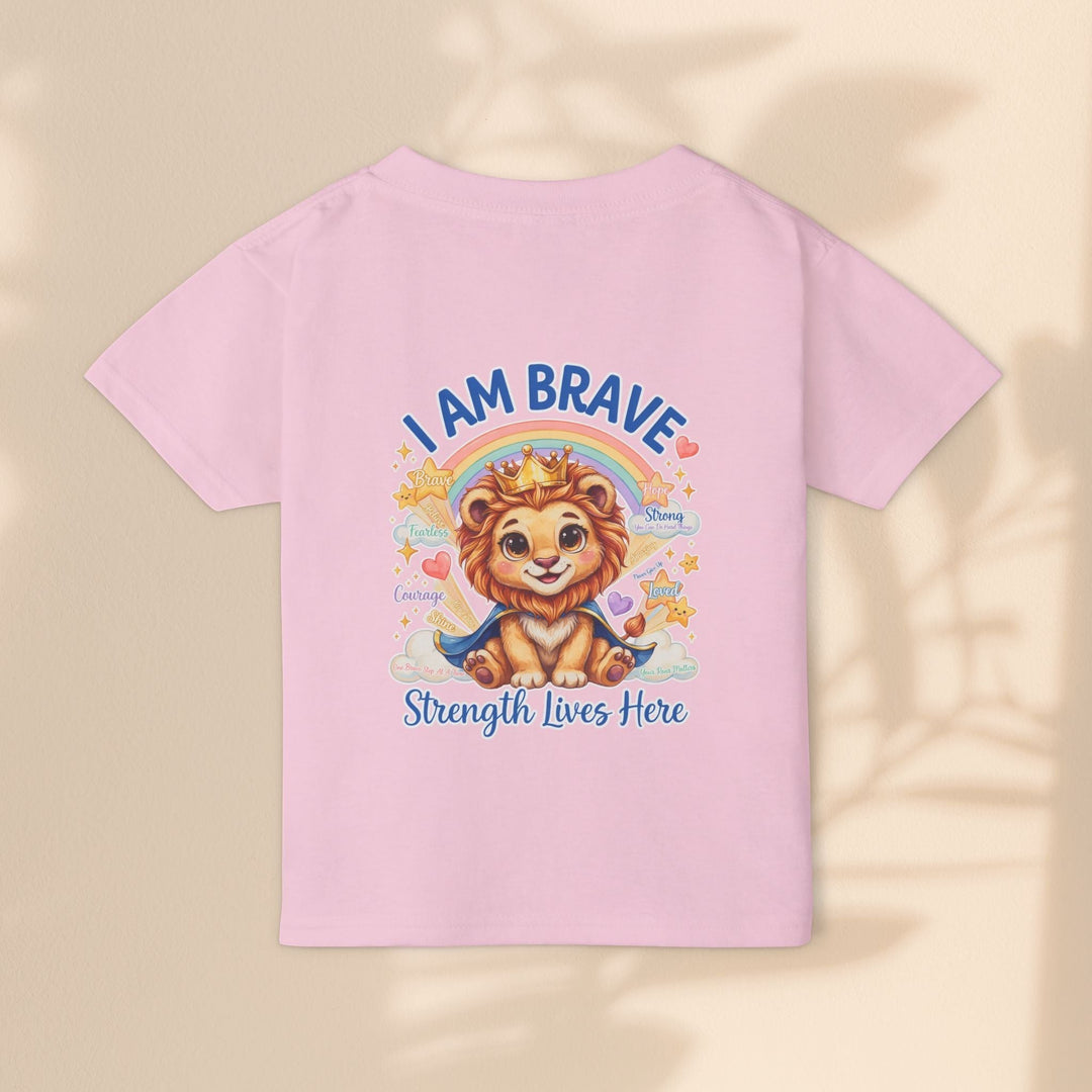 Sea Dragon Dreams toddler t-shirt in light pink cotton featuring a cute lion graphic with the text I Am Brave