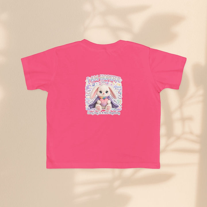 Sea Dragon Dreams pink toddler tee featuring the Brave Buddies Hope Bunny graphic with the text I Am Hopeful.
