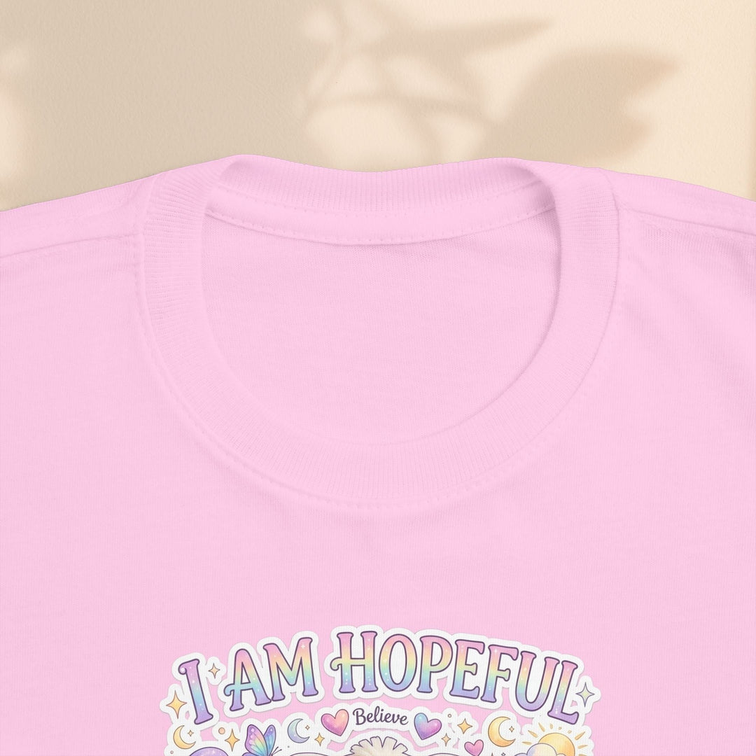 Sea Dragon Dreams toddler tee in light pink cotton featuring the Brave Buddies Hope Bunny I Am Hopeful graphic