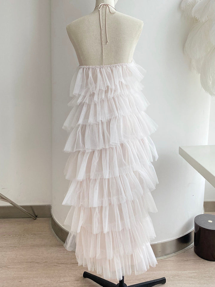 Sea Dragon Dreams halter prom dress in soft pink tulle with a layered ruffle hem on a mannequin