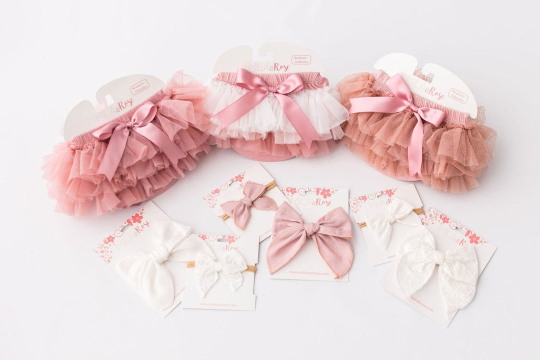 Sea Dragon Dreams vintage pink ombre ruffle tutu bloomers and matching hair bows for baby girls on white background