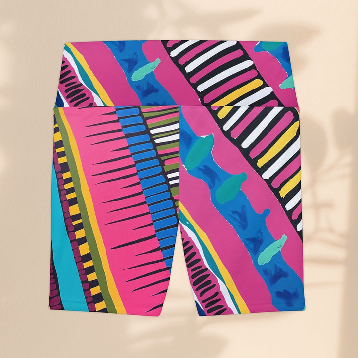 Sea Dragon Dreams women's workout shorts featuring a vibrant pink, blue, and yellow abstract party pattern.
