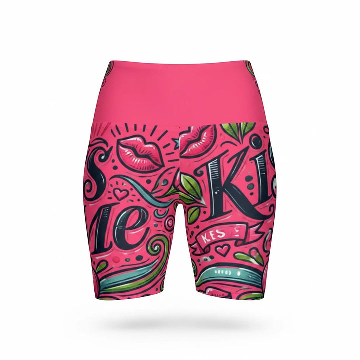 Sea Dragon Dreams high-waisted workout shorts in pink with a playful Kiss Me graphic print and moisture-wicking fabric
