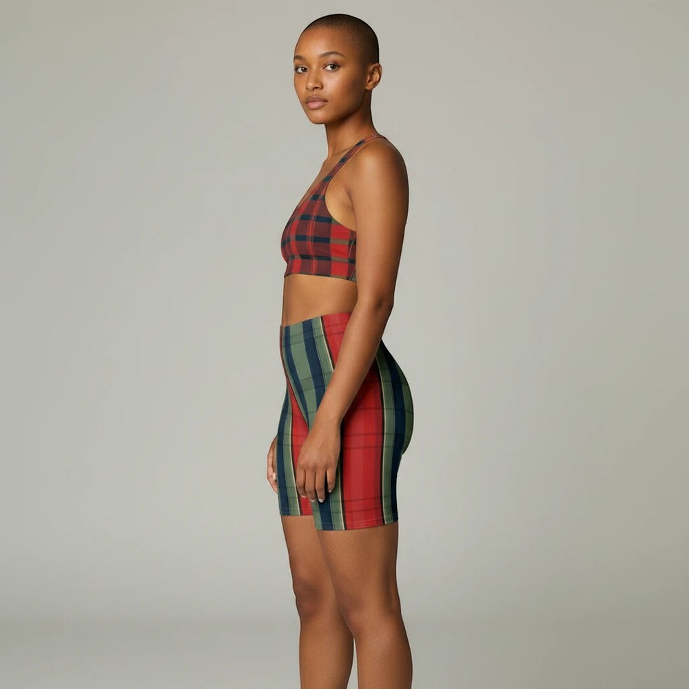 Model wearing Sea Dragon Dreams high-waisted biker shorts in a retro green and red plaid stripe performance fabric