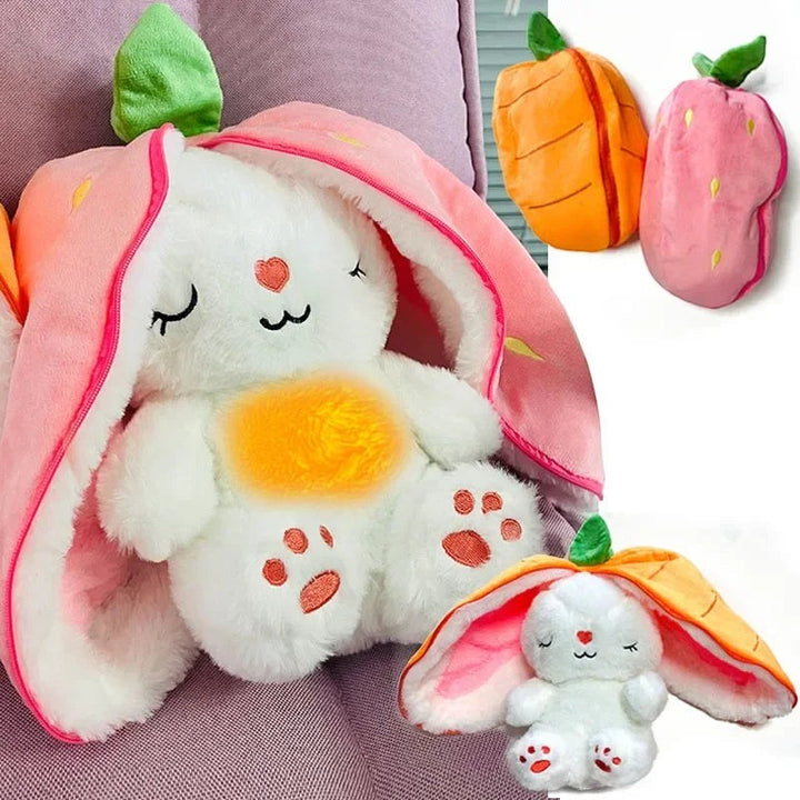 Sea Dragon Dreams plush bunny toy with a soft white body and a reversible strawberry or carrot-shaped hood