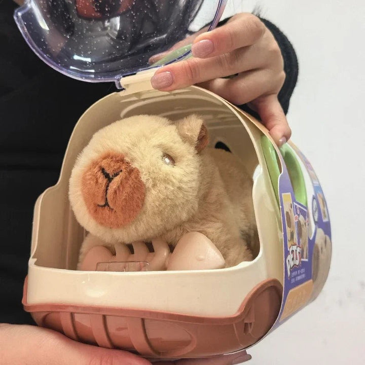 Sea Dragon Dreams electric plush capybara toy inside a small plastic travel carrier for kids