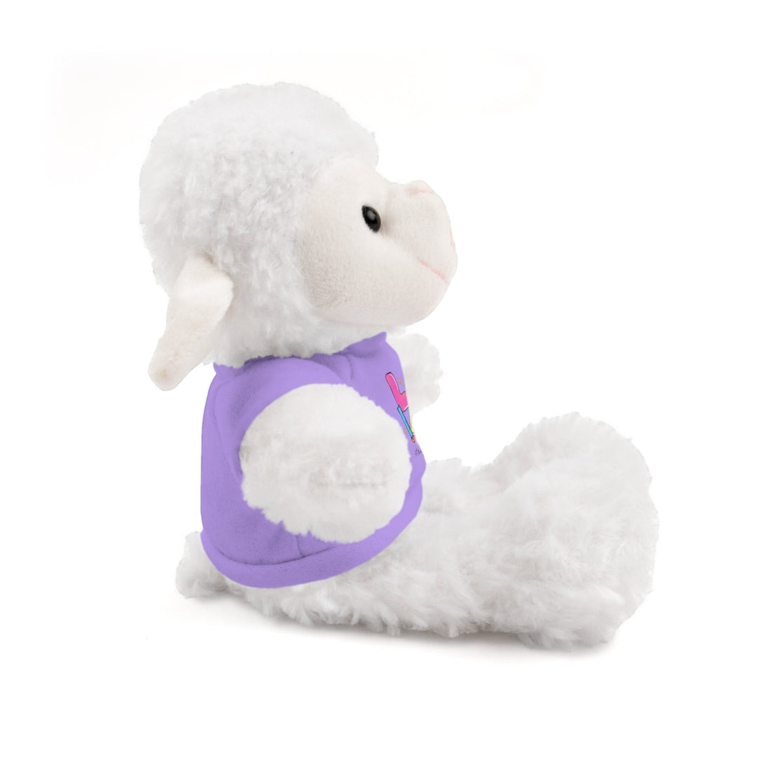 Sea Dragon Dreams white plush sheep stuffed animal wearing a purple cotton t-shirt with Love Teacher Life design