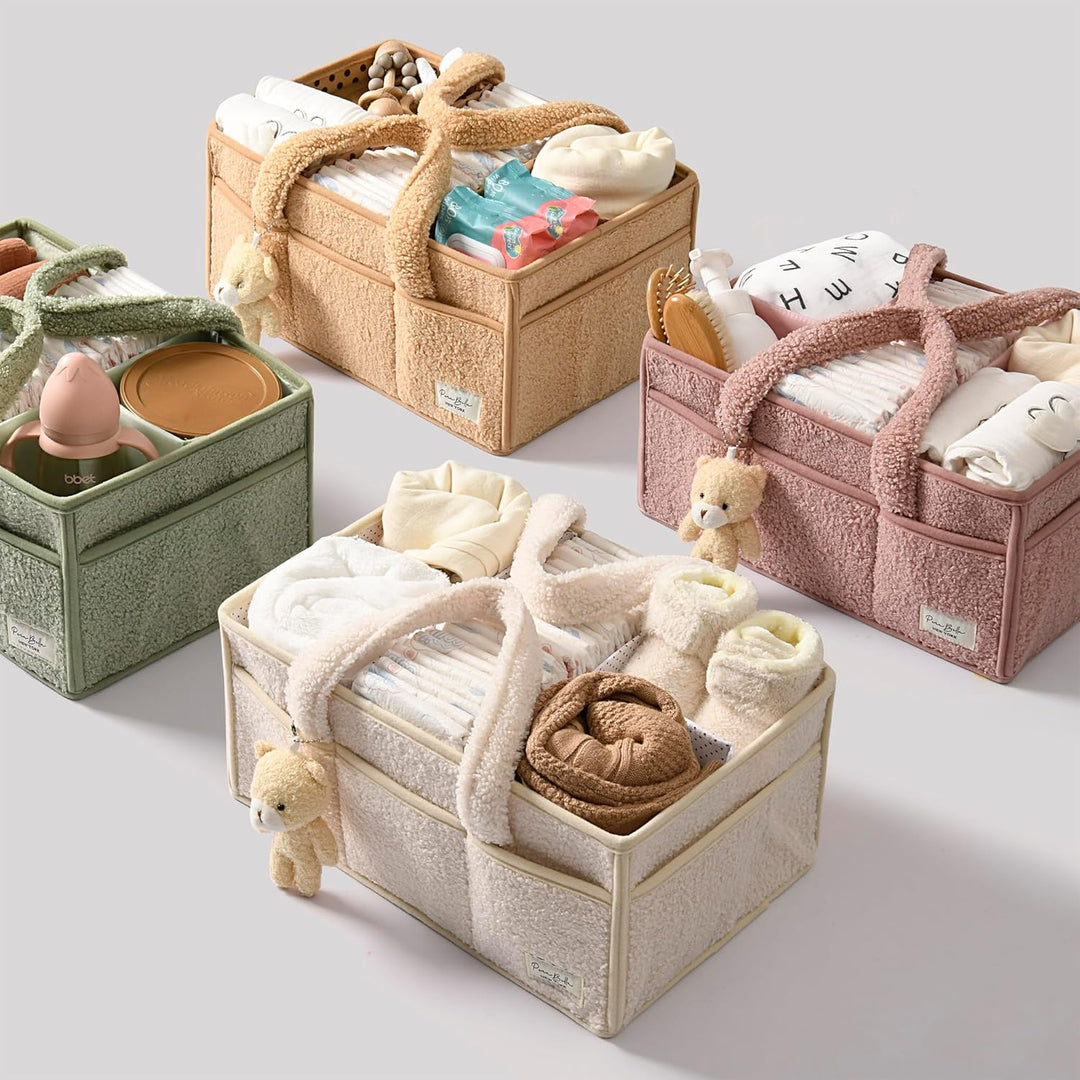 Sea Dragon Dreams plush sherpa diaper caddies in beige, pink, green, and tan with teddy bear charms and baby supplies.