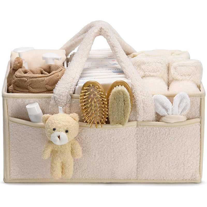 Sea Dragon Dreams plush sherpa diaper caddy with teddy bear charm, organized with baby essentials and dividers.
