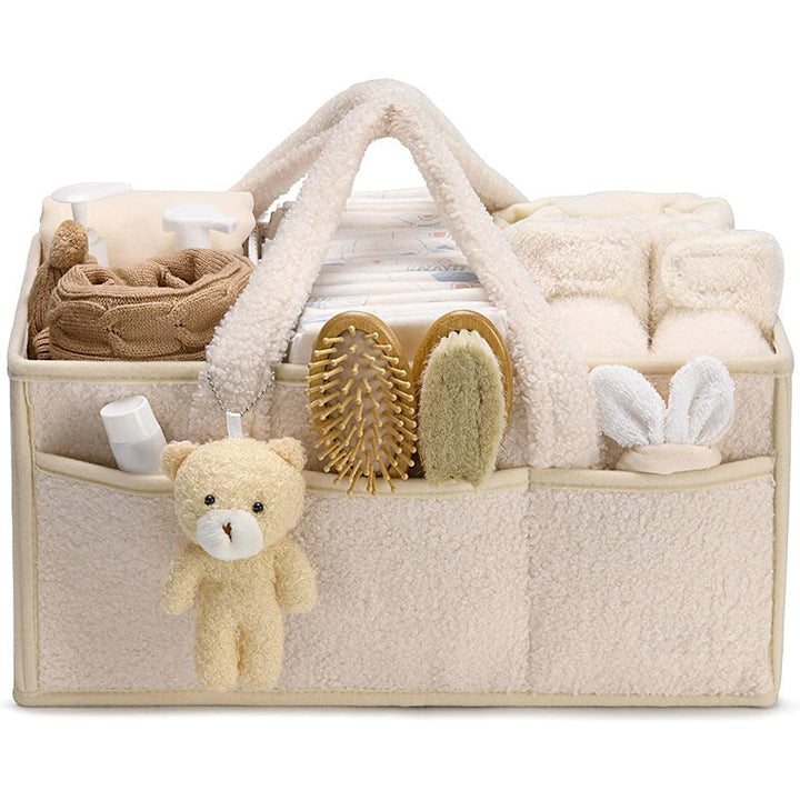 Sea Dragon Dreams plush sherpa diaper caddy with teddy bear charm, organized with baby essentials and dividers.