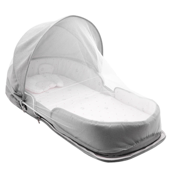 Sea Dragon Dreams portable grey baby lounger with a protective mosquito net canopy and soft interior cushion