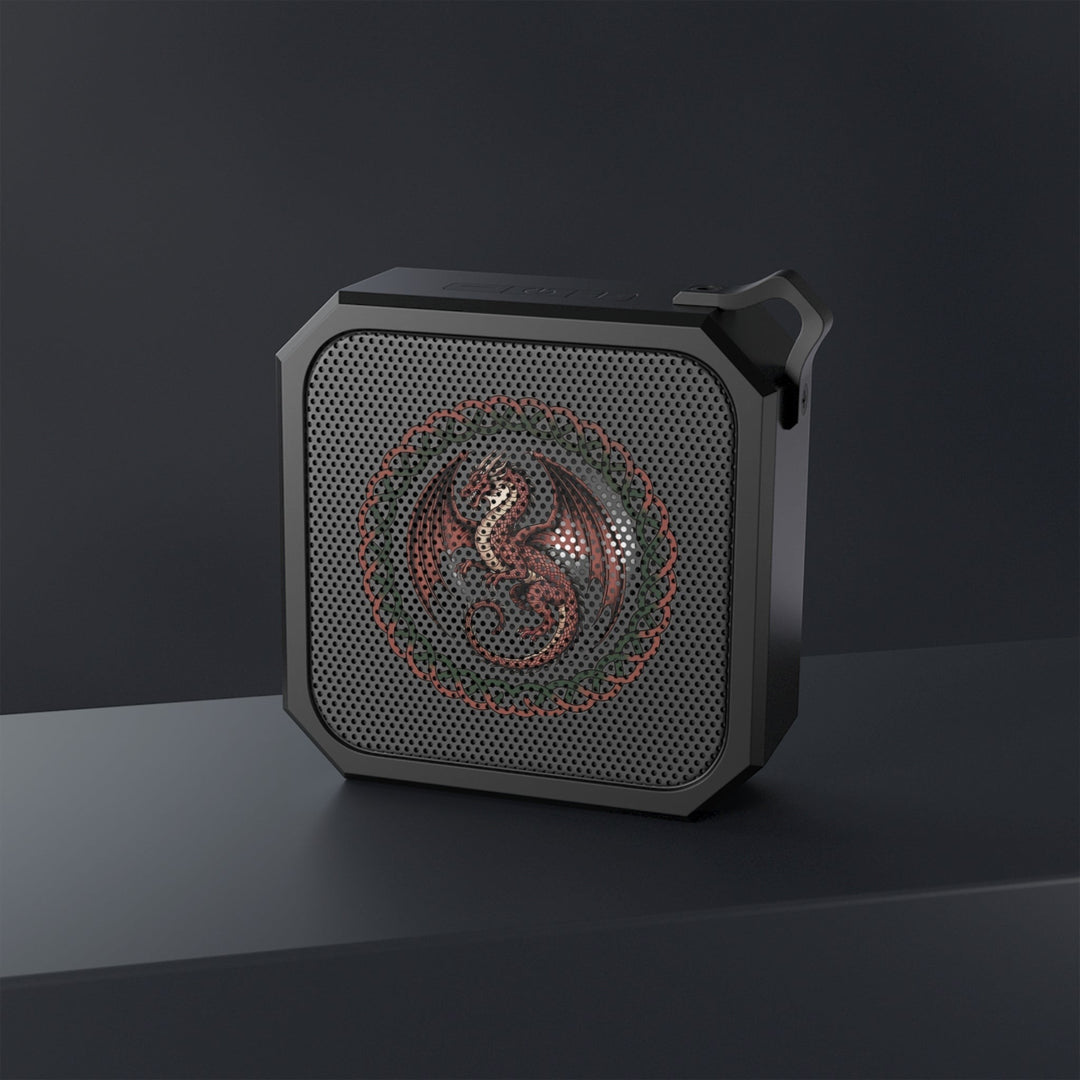 Sea Dragon Dreams rugged portable Bluetooth speaker with a detailed dragon emblem on a black perforated grille.