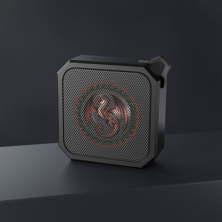 Sea Dragon Dreams rugged portable Bluetooth speaker with a detailed dragon emblem on a black perforated grille.