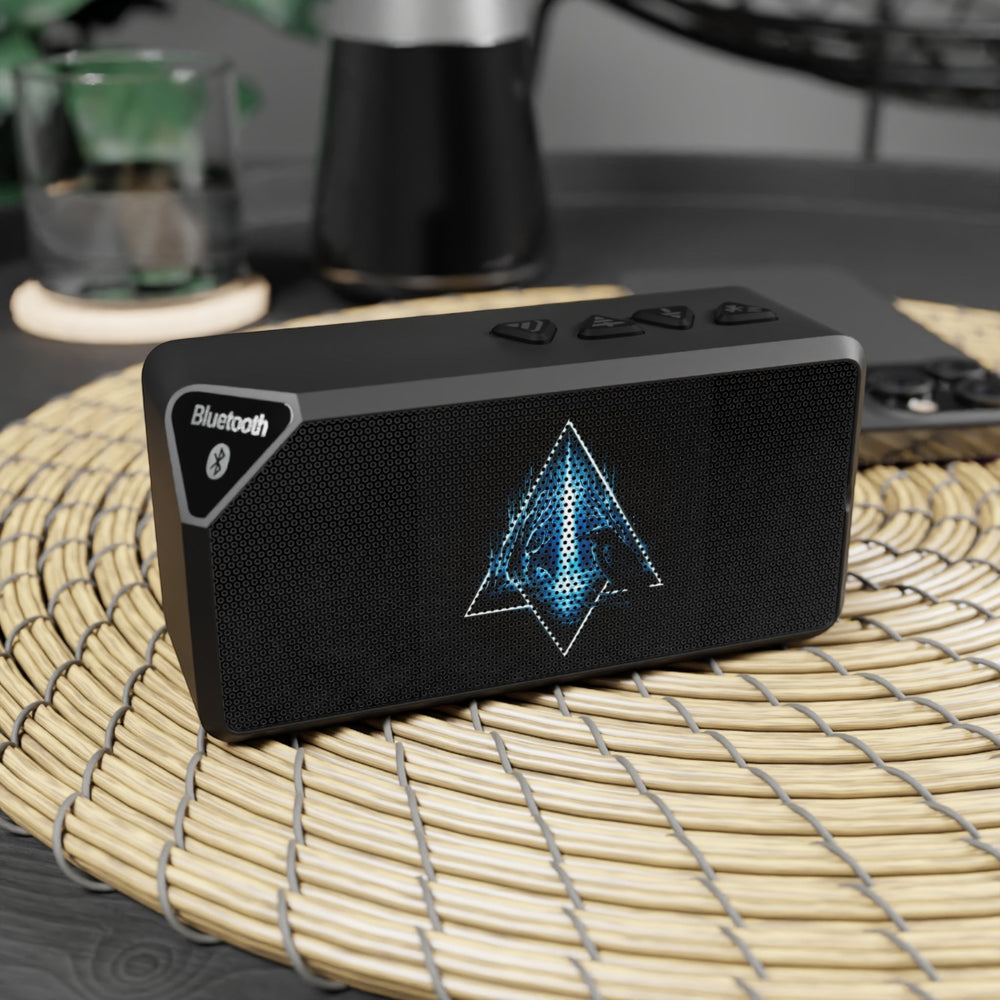 Sea Dragon Dreams portable Bluetooth speaker in matte black with an illuminated geometric emblem on the front grille.