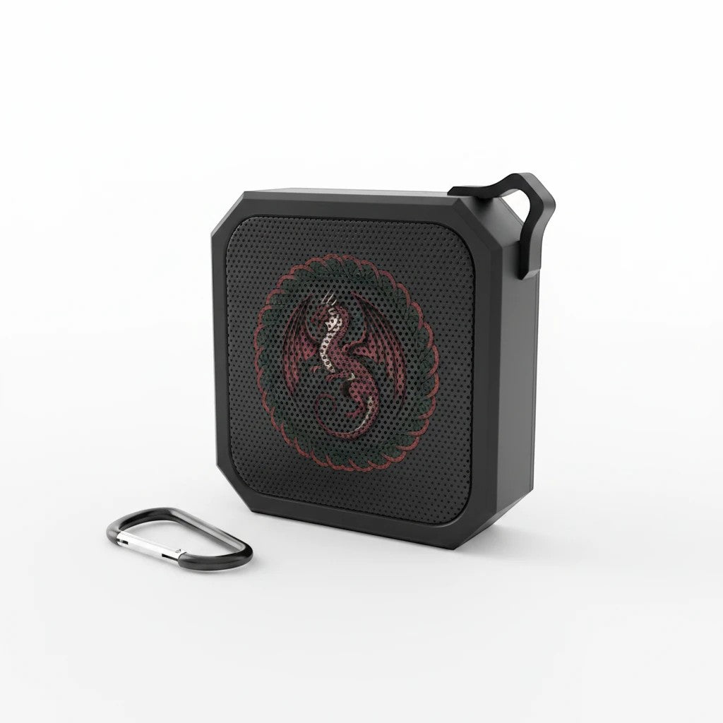 Sea Dragon Dreams portable Bluetooth speaker in black with a red dragon emblem and included carabiner clip.