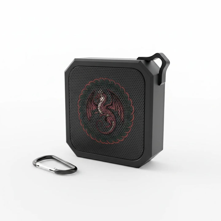 Sea Dragon Dreams portable Bluetooth speaker in black with a red dragon emblem and included carabiner clip.