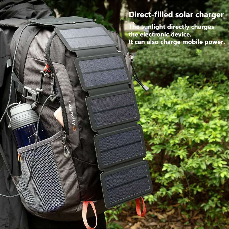Sea Dragon Dreams portable folding solar panel charger attached to a hiking backpack for outdoor device charging