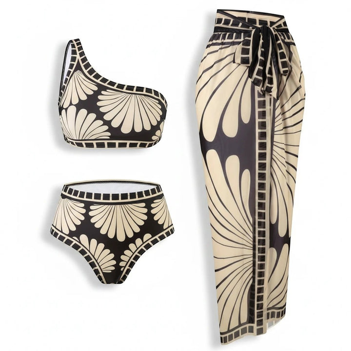 Sea Dragon Dreams 3-piece bikini set with one-shoulder top, high-waisted bottoms, and skirt in black and cream print.