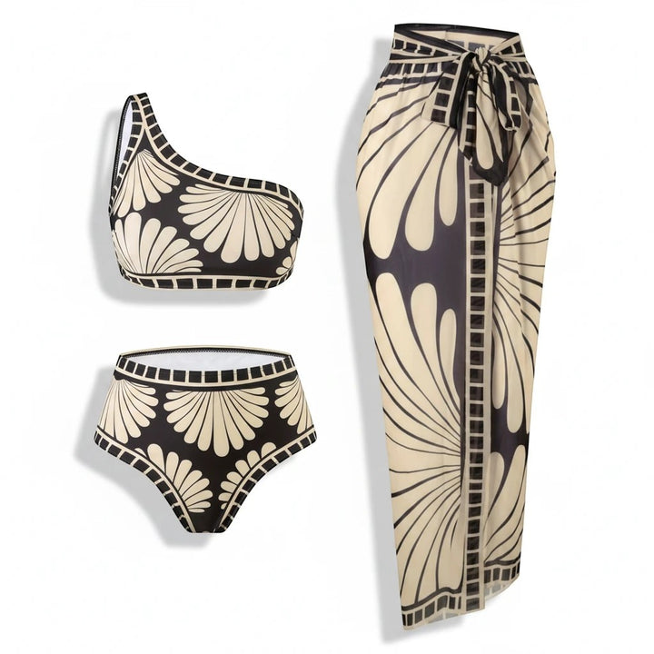 Sea Dragon Dreams 3-piece bikini set with one-shoulder top, high-waisted bottoms, and matching skirt in black and cream.
