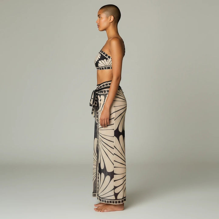 Sea Dragon Dreams one-shoulder bikini set with matching cover-up skirt in a black and beige floral print
