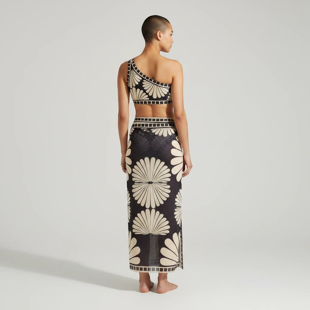 Sea Dragon Dreams one-shoulder bikini set with matching long cover-up skirt in a black and cream floral print