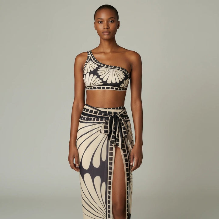Sea Dragon Dreams one-shoulder bikini set with matching cover-up skirt in a black and cream shell-inspired print
