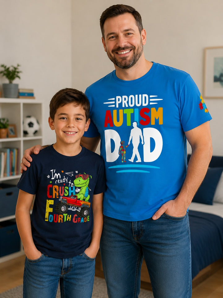 Sea Dragon Dreams blue Proud Autism Dad t-shirt worn by a smiling father standing next to his son in a bedroom.