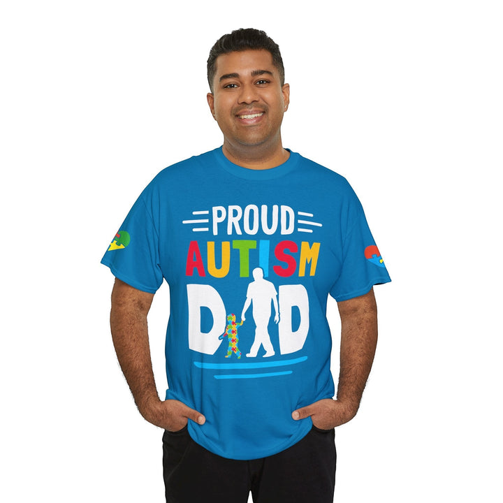 Sea Dragon Dreams blue heavy cotton t-shirt with Proud Autism Dad graphic worn by a smiling man.
