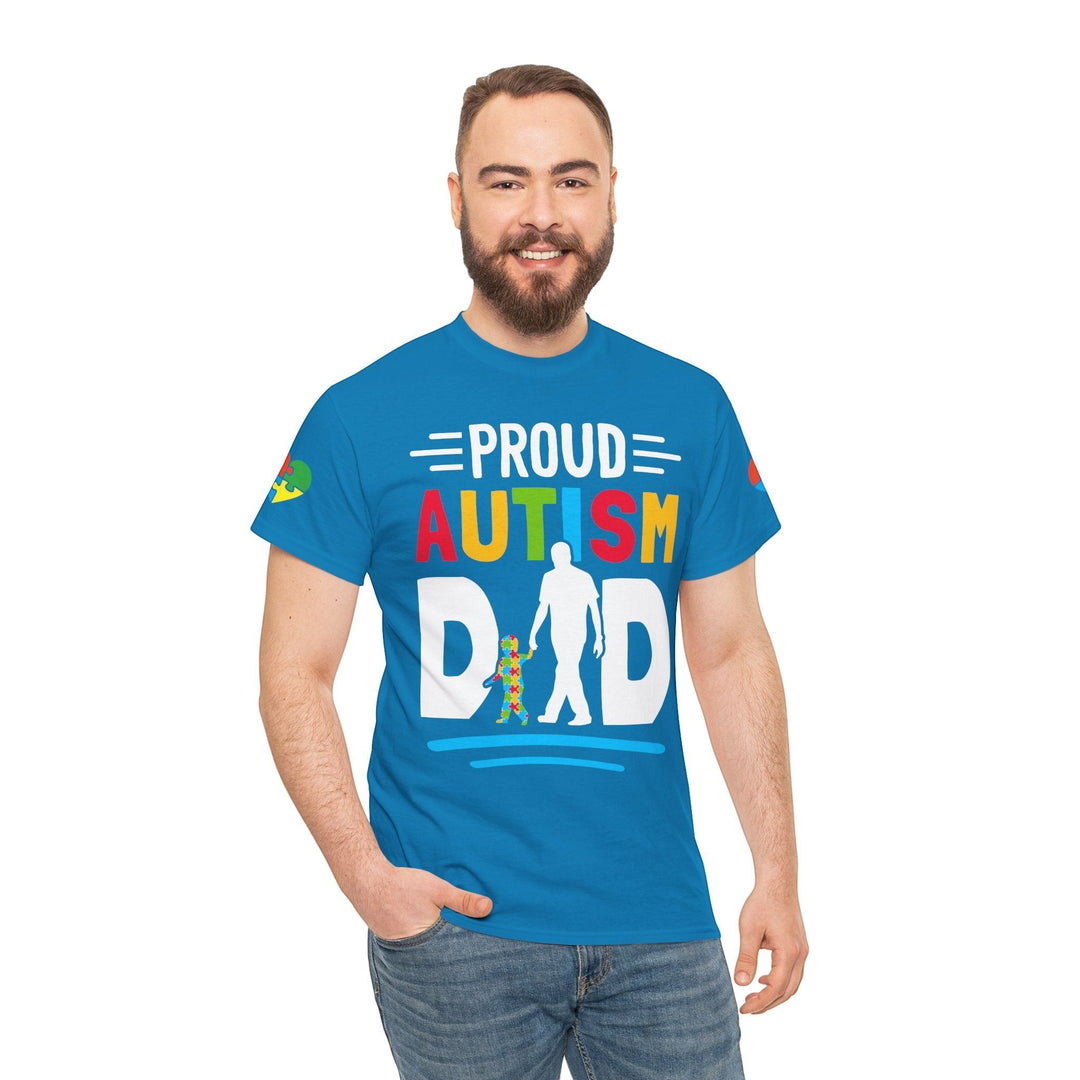 Sea Dragon Dreams blue heavy cotton t-shirt featuring a colorful Proud Autism Dad graphic worn by a smiling man.
