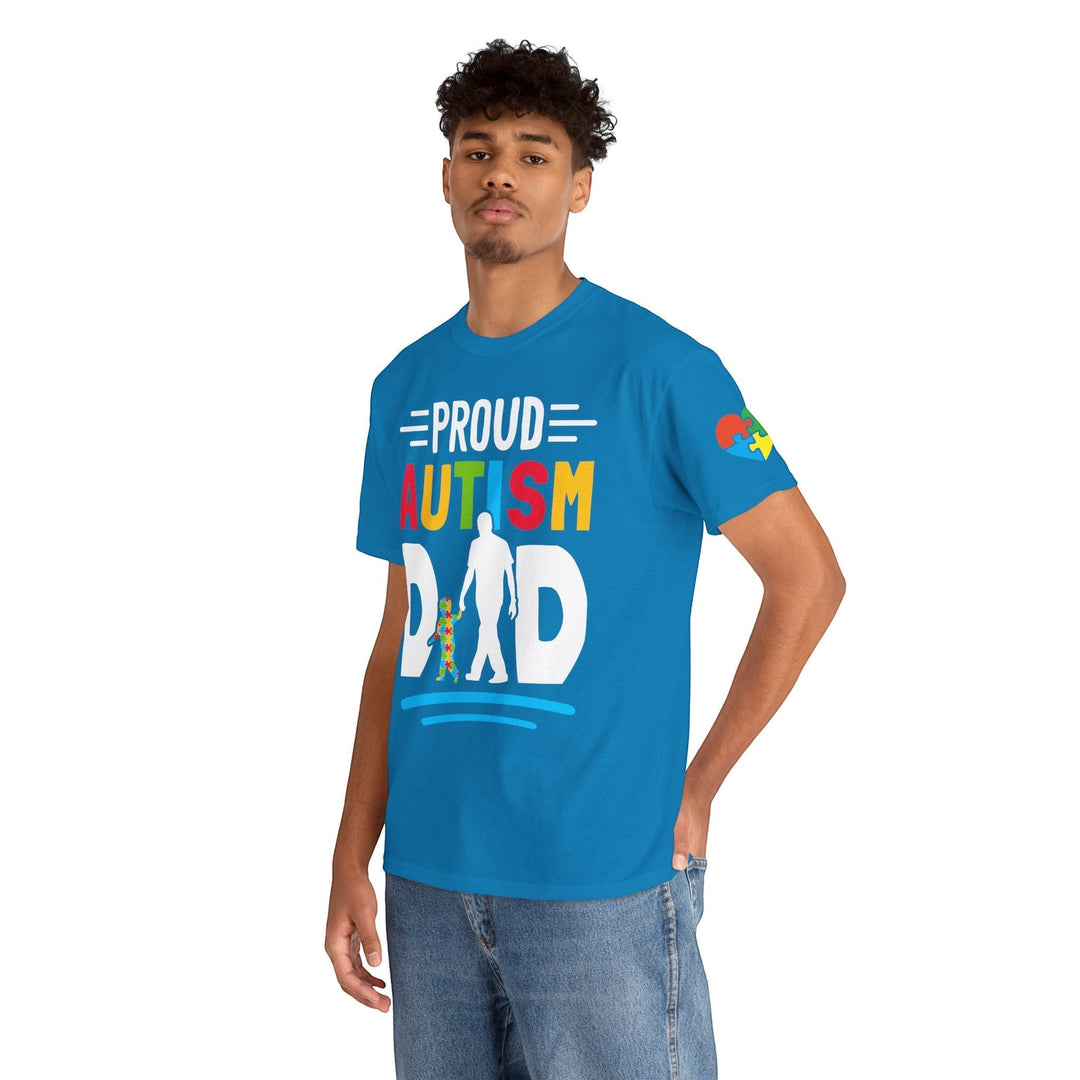 Sea Dragon Dreams blue heavy cotton t-shirt with Proud Autism Dad graphic, worn by a man in jeans.